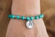 bracelet OM en turquoise porté